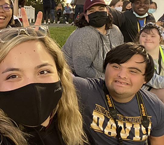 a group of people smiling at a camera