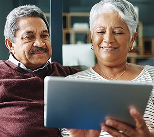 two people looking at a computer