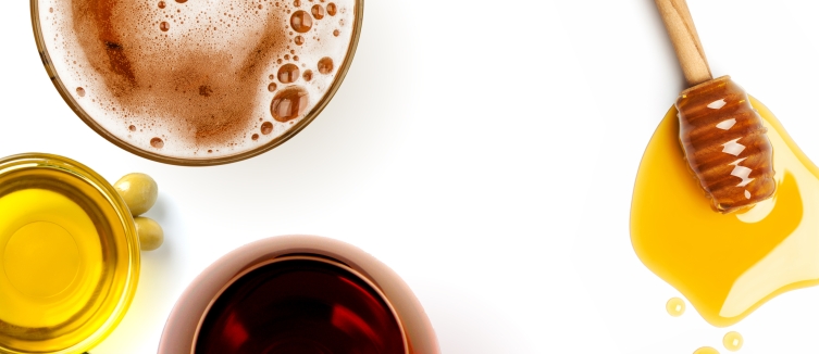 cups of drinks sitting on a white surface