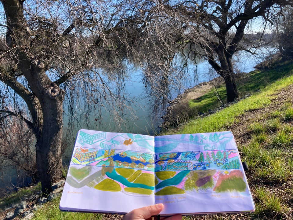 Mural sketch in front of river